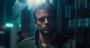 Movie still from “The Terminator” (1984), directed by James Cameron – A person wearing a jacket; Close Up shot, Low angle