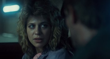 Movie still from “The Terminator” (1984), directed by James Cameron – A woman is looking at a man in the mirror; Close Up shot, Over the shoulder angle