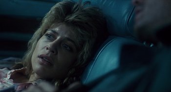 Movie still from “The Terminator” (1984), directed by James Cameron – A person laying in a chair; Close Up shot, Low angle