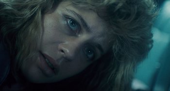 Movie still from “The Terminator” (1984), directed by James Cameron – A woman's face with blue eyes; Close Up shot, Low angle