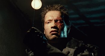 Movie still from “The Terminator” (1984), directed by James Cameron – A person with a face covered in blood; Close Up shot, Low angle