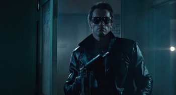 Movie still from “The Terminator” (1984), directed by James Cameron – A man wearing a leather jacket and sunglasses; Medium shot, Low angle
