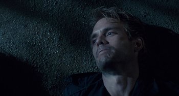 Movie still from “The Terminator” (1984), directed by James Cameron – A person looking up at the sky; Close Up shot, Overhead angle