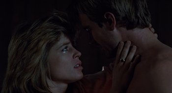 Movie still from “The Terminator” (1984), directed by James Cameron – A man and a woman are looking at each other in the dark; Close Up shot, Low angle