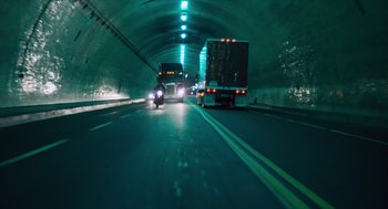 Movie still from “The Terminator” (1984), directed by James Cameron – A truck driving down a road in a tunnel; Extreme Wide shot, Low angle