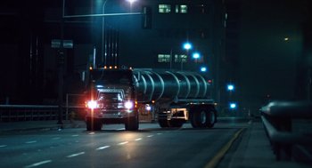 Movie still from “The Terminator” (1984), directed by James Cameron – A truck is driving down the street at night; Extreme Wide shot, Low angle