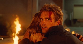 Movie still from “The Terminator” (1984), directed by James Cameron – A man and a woman with blood on their faces; Close Up shot, Over the shoulder angle