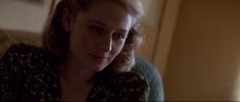 Movie still from “The Thin Red Line” (1998), directed by Terrence Malick – A woman's face with her hand on her shoulder; Close Up shot, Over the shoulder angle