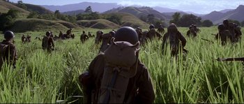 Movie still from “The Thin Red Line” (1998), directed by Terrence Malick – Wide shot, Over the shoulder angle