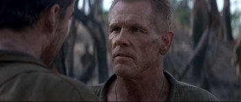 Movie still from “The Thin Red Line” (1998), directed by Terrence Malick – A person wearing a shirt; Close Up shot, Over the shoulder angle