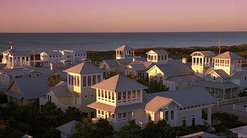 Movie still from “The Truman Show” (1998), directed by Peter Weir – A bunch of houses that are on the side of a beach; Extreme Wide shot, High angle