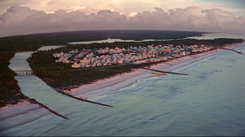Movie still from “The Truman Show” (1998), directed by Peter Weir – An aerial view of the ocean and a city; Extreme Wide shot, High angle