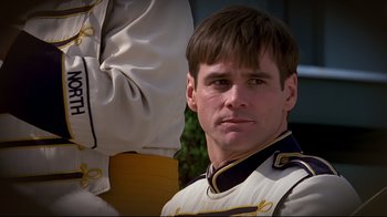 Movie still from “The Truman Show” (1998), directed by Peter Weir – A person wearing a uniform; Close Up shot, Low angle