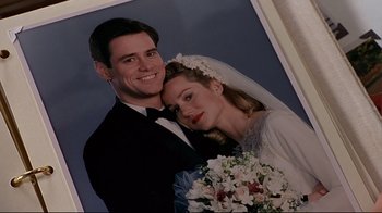 Movie still from “The Truman Show” (1998), directed by Peter Weir – A man and a woman posing for a wedding picture; Close Up shot, Low angle