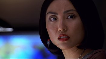 Movie still from “The Truman Show” (1998), directed by Peter Weir – A person wearing a headset; Close Up shot, Over the shoulder angle