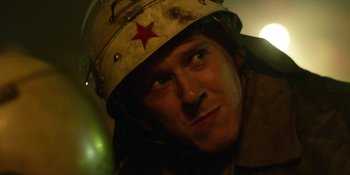 Movie still from “Chernobyl” (2019), directed by Johan Renck – A person wearing a helmet; Close Up shot, Low angle
