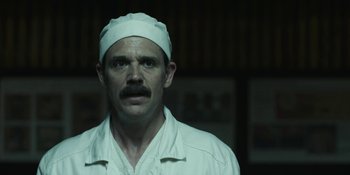 Movie still from “Chernobyl” (2019), directed by Johan Renck – A man in a white hat and a white shirt; Close Up shot, Low angle