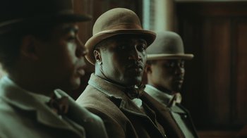 Movie still from “The Underground Railroad” (2021), directed by Barry Jenkins – Medium shot, Low angle