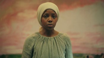 Movie still from “The Underground Railroad” (2021), directed by Barry Jenkins – Medium shot, Low angle