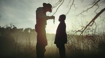 Movie still from “The Underground Railroad” (2021), directed by Barry Jenkins – Medium shot, Low angle