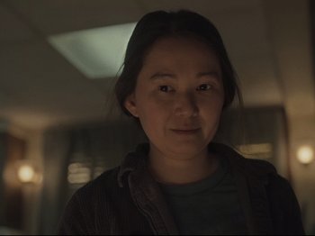 Movie still from “The Whale” (2022), directed by Darren Aronofsky – A young woman is looking at the camera; Close Up shot, Over the shoulder angle