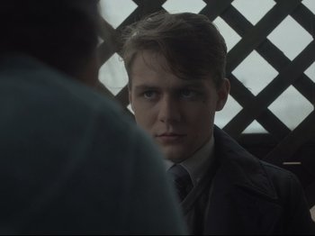 Movie still from “The Whale” (2022), directed by Darren Aronofsky – A man in a suit and tie looking at a man in a tie; Close Up shot, Over the shoulder angle