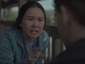 Movie still from “The Whale” (2022), directed by Darren Aronofsky – An asian woman talking to a man on a porch; Close Up shot, Over the shoulder angle