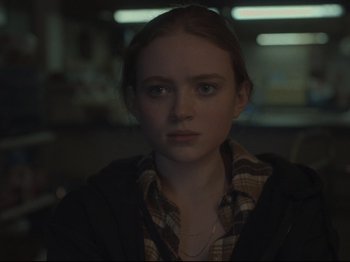 Movie still from “The Whale” (2022), directed by Darren Aronofsky – A woman with red hair is staring at the camera; Close Up shot, Over the shoulder angle
