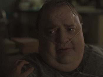 Movie still from “The Whale” (2022), directed by Darren Aronofsky – A person with a nose ring; Close Up shot, Low angle