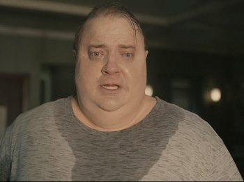 Movie still from “The Whale” (2022), directed by Darren Aronofsky – A man with a very large head and a very big face; Close Up shot, Over the shoulder angle