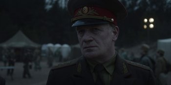 Movie still from “Chernobyl” (2019), directed by Johan Renck – A person wearing a military uniform; Close Up shot, Over the shoulder angle