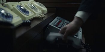 Movie still from “Chernobyl” (2019), directed by Johan Renck – A person is playing a game on a remote control device; Extreme Close Up shot, High angle