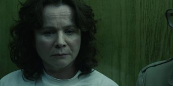 Movie still from “Chernobyl” (2019), directed by Johan Renck – A person wearing a white t - shirt; Close Up shot, Low angle
