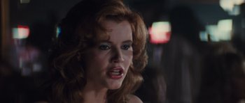 Movie still from “Thelma & Louise” (1991), directed by Ridley Scott – A person with red hair; Close Up shot, Over the shoulder angle