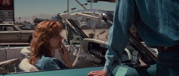 Movie still from “Thelma & Louise” (1991), directed by Ridley Scott – A woman sitting in the driver's seat of a car; Medium shot, Over the shoulder angle