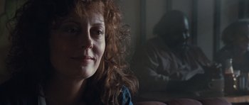 Movie still from “Thelma & Louise” (1991), directed by Ridley Scott – A person with curly red hair; Close Up shot, Over the shoulder angle