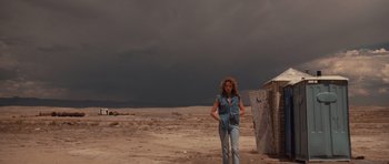 Movie still from “Thelma & Louise” (1991), directed by Ridley Scott – A woman standing in the middle of the desert; Wide shot, Low angle