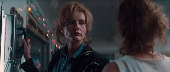 Movie still from “Thelma & Louise” (1991), directed by Ridley Scott – A person wearing a jacket; Close Up shot, Over the shoulder angle