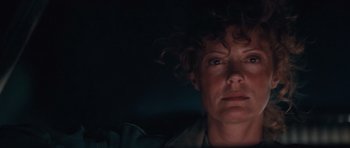 Movie still from “Thelma & Louise” (1991), directed by Ridley Scott – A person with curly brown hair; Close Up shot, Low angle