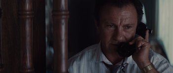 Movie still from “Thelma & Louise” (1991), directed by Ridley Scott – A person holding a cell phone; Close Up shot, Low angle