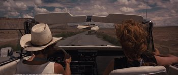 Movie still from “Thelma & Louise” (1991), directed by Ridley Scott – Two women driving a car on a road; Wide shot, Over the shoulder angle