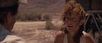 Movie still from “Thelma & Louise” (1991), directed by Ridley Scott – A person with curly hair; Close Up shot, Low angle