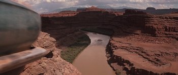 Movie still from “Thelma & Louise” (1991), directed by Ridley Scott – A view of a river flowing through a canyon; Extreme Wide shot, High angle