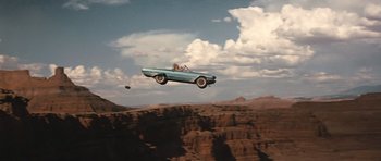 Movie still from “Thelma & Louise” (1991), directed by Ridley Scott – A car flying through the air over a cliff; Extreme Wide shot, Overhead angle
