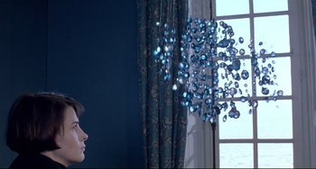 Movie still from “Three Colors: Blue” (1993), directed by Krzysztof Kieslowski – Medium shot, Low angle