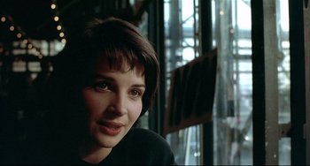 Movie still from “Three Colors: Blue” (1993), directed by Krzysztof Kieslowski – Close Up shot, Over the shoulder angle