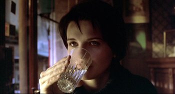 Movie still from “Three Colors: Blue” (1993), directed by Krzysztof Kieslowski – Close Up shot, Over the shoulder angle
