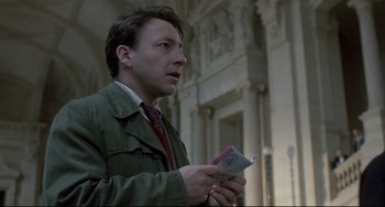 Movie still from “Three Colors: White” (1994), directed by Krzysztof Kieslowski – Close Up shot, Low angle