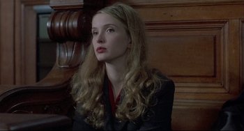 Movie still from “Three Colors: White” (1994), directed by Krzysztof Kieslowski – Close Up shot, Over the shoulder angle