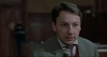 Movie still from “Three Colors: White” (1994), directed by Krzysztof Kieslowski – Close Up shot, Low angle